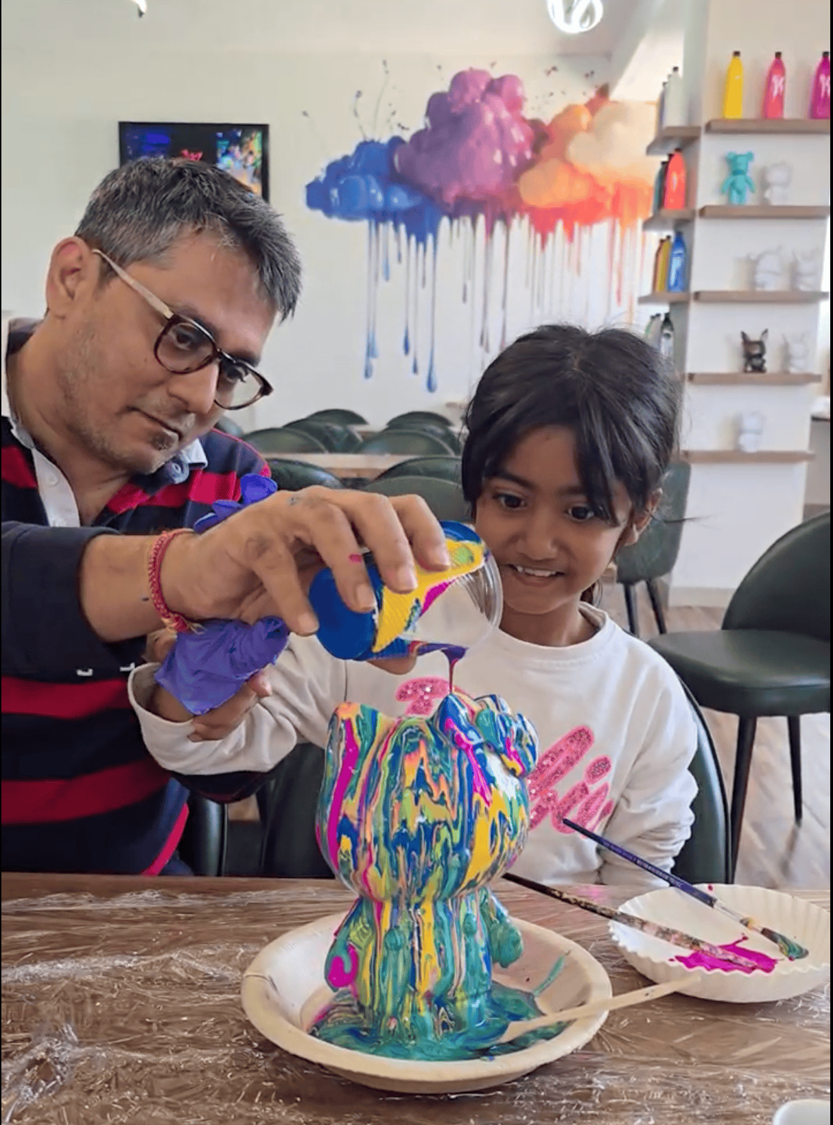 Colourful acrylic-poured plaster teddy bear made at Splashit